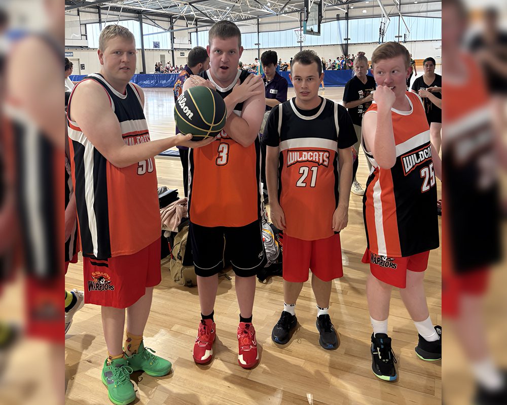 A group of men standing next to each other on a court.