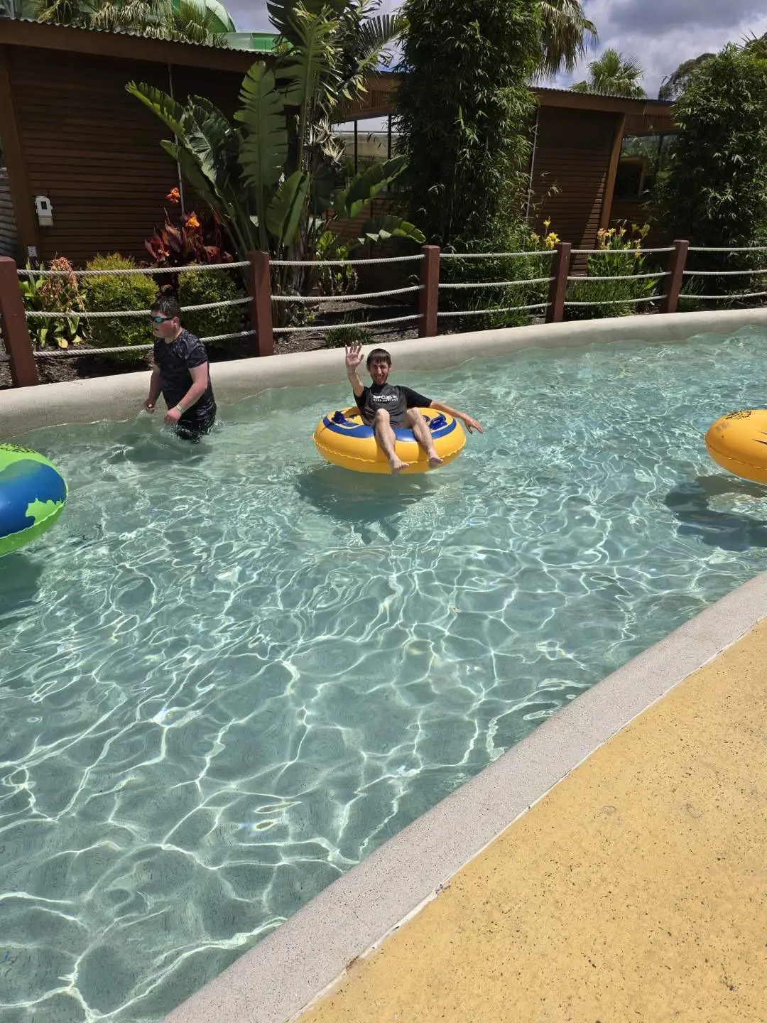 A group of people in the water at an amusement park.