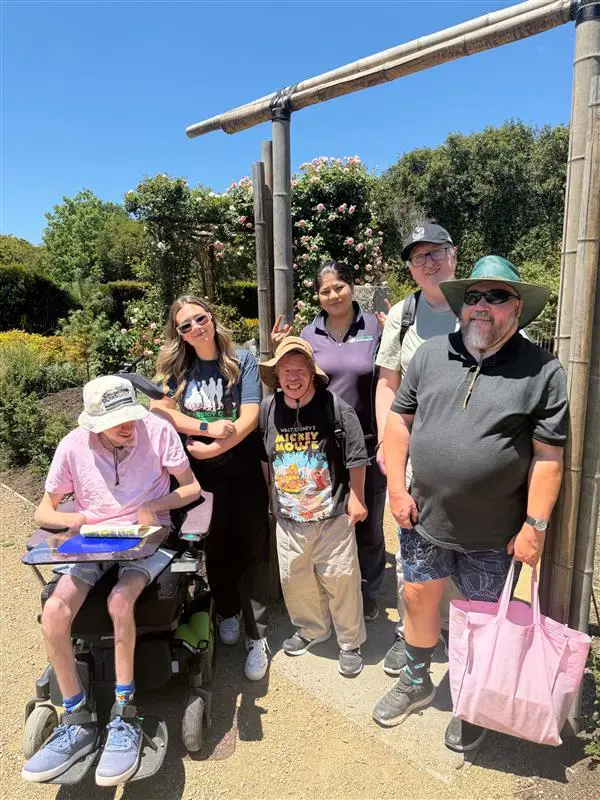 A group of people standing next to each other.
