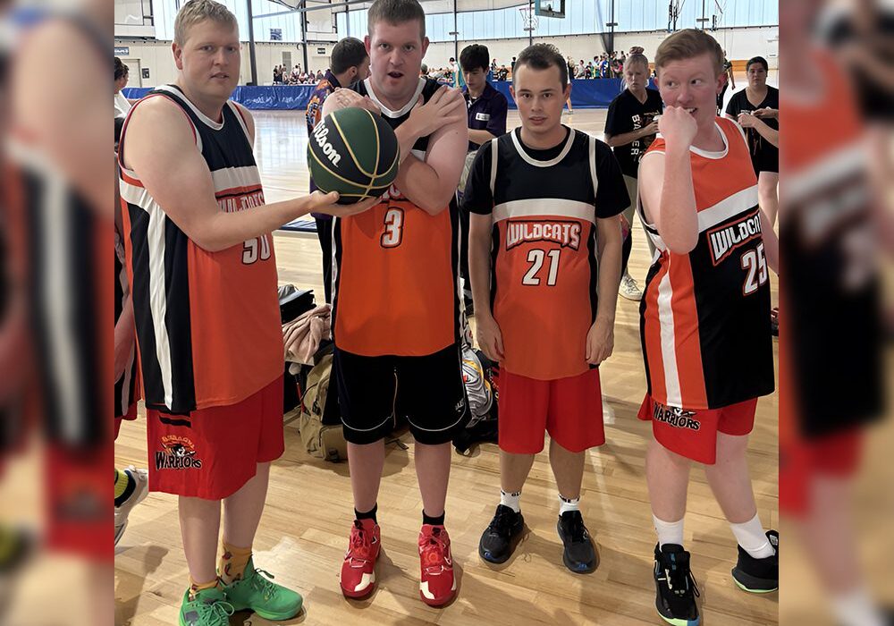 A group of men standing next to each other on a court.
